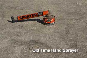 old time hand sprayer black flag